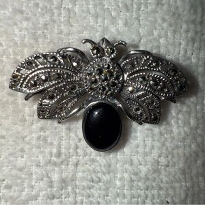 Elegant Silver and Black Brooch